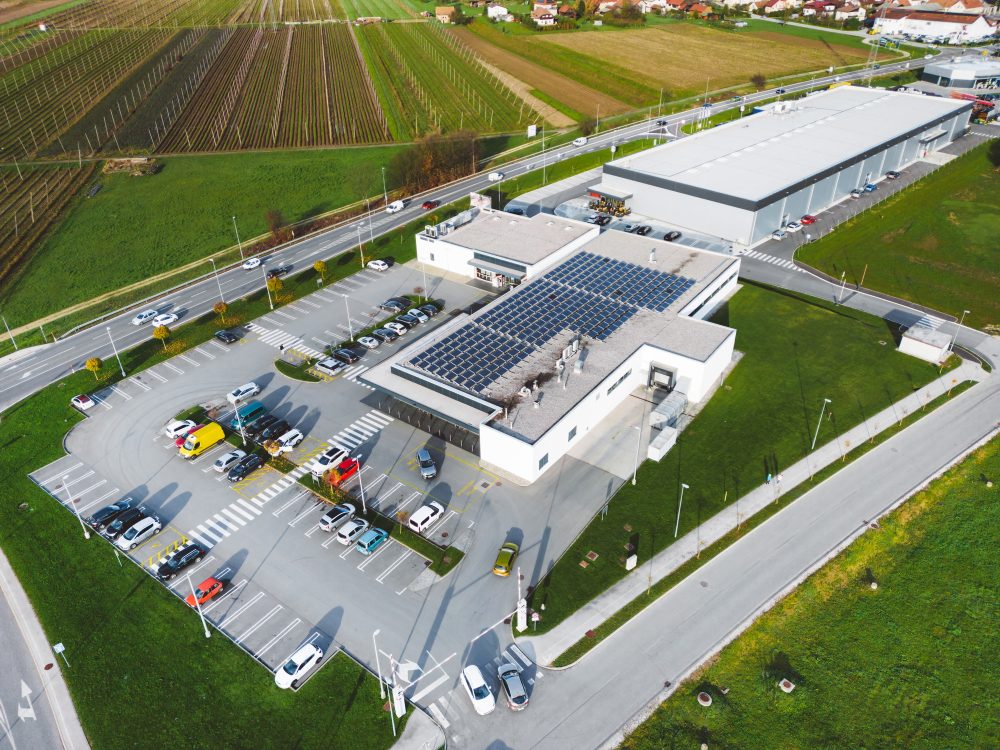 aerial-view-of-an-industrial-building-with-solar-panels-on-the-roof-e1753185587905.jpg